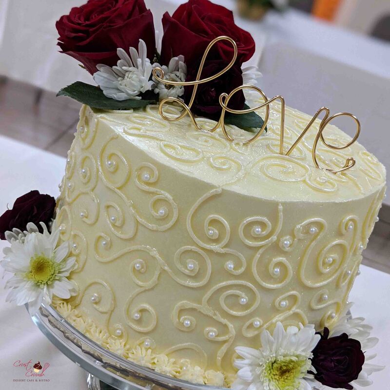 White chocolate swirls and white pearls cake