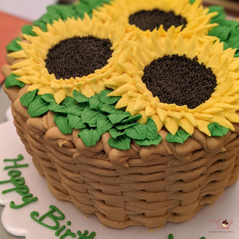 Whipped cream frosting basket of sunflowers piped cake