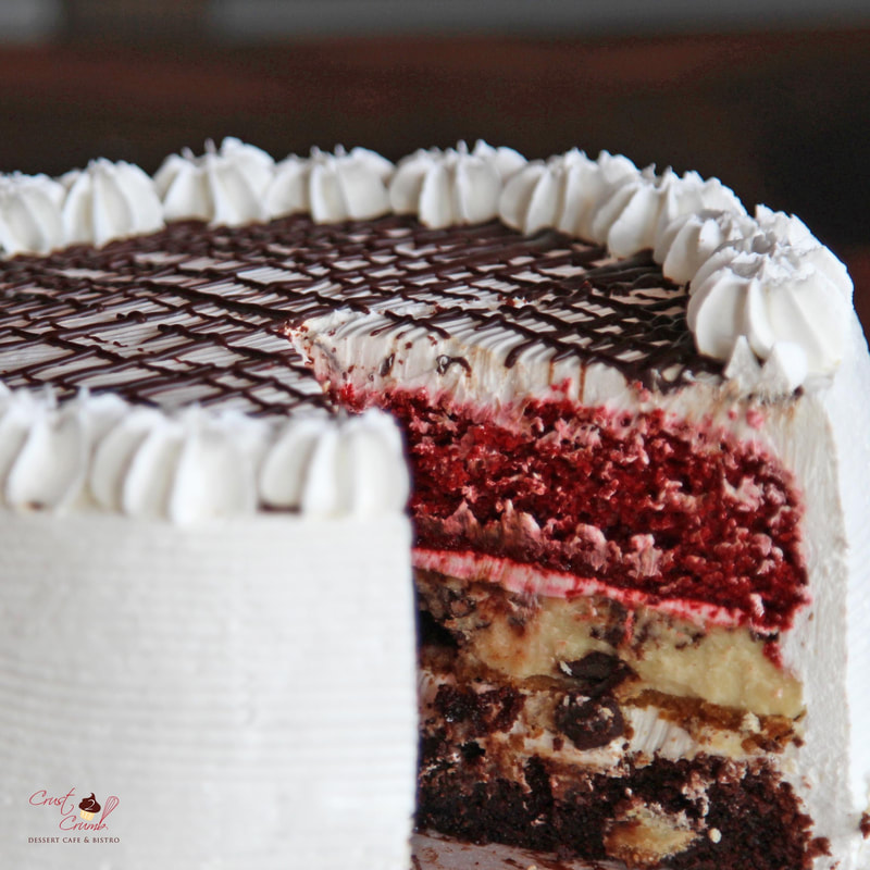 Red velvet, Cheesecake, and Chocolate cake layers combined to make the Crust2Crumb Signature Trini Cake