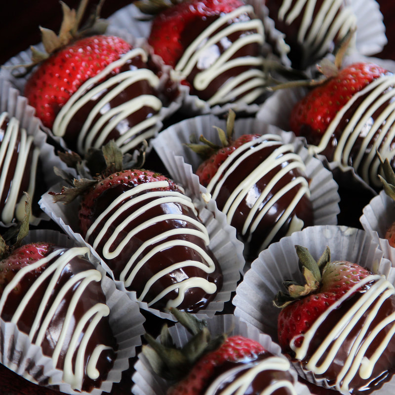 Chocolate covered strawberries with a white chocolate drizzle at Crust2Crumb, Trinidad